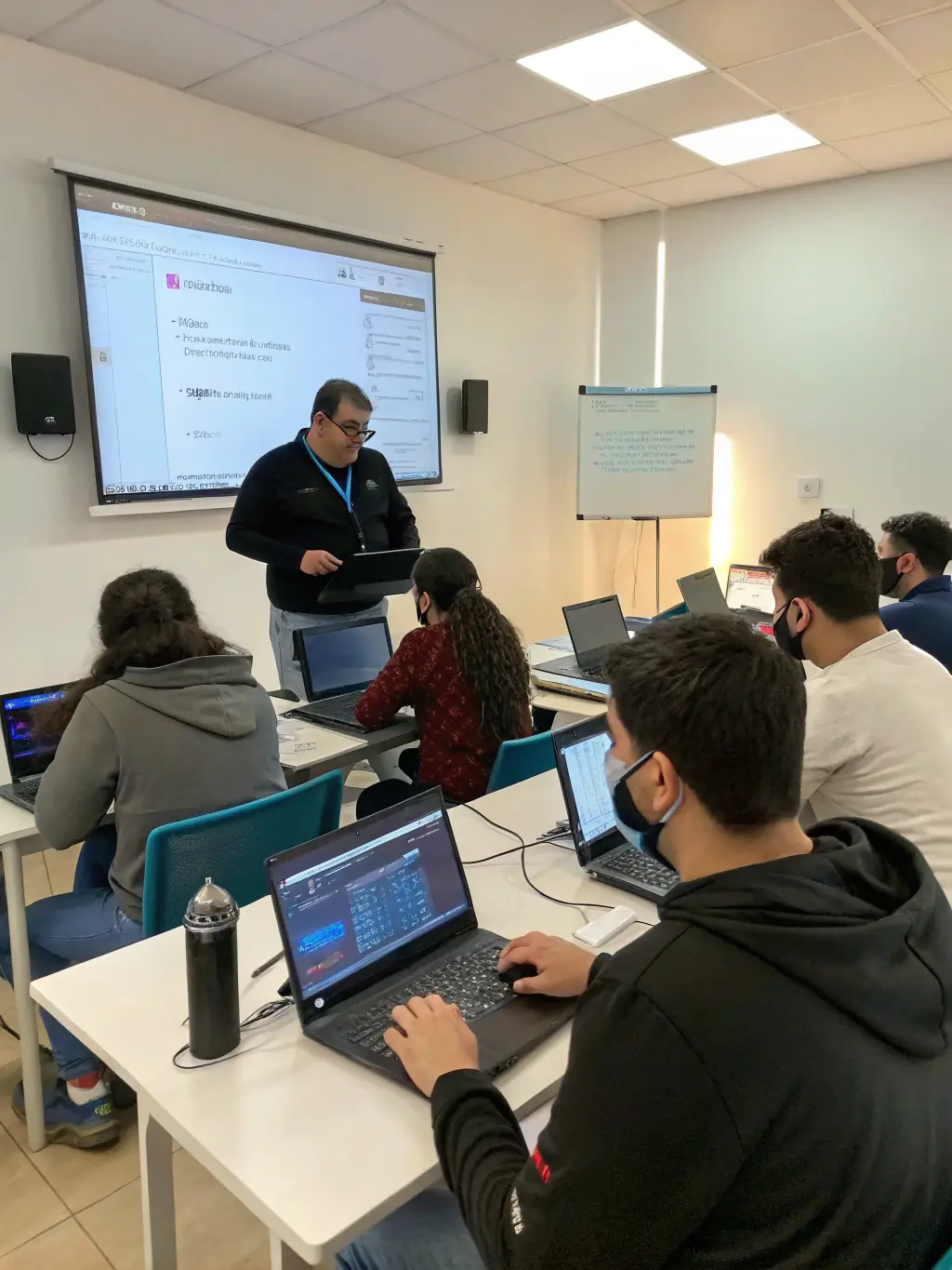 A group of Dynamic Data Solutions employees participating in a cybersecurity training session, highlighting the company's investment in employee development and continuous learning.
